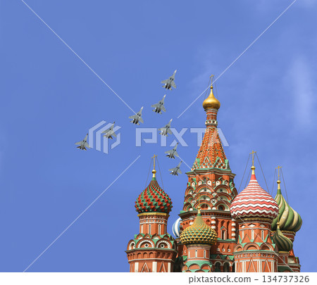 Temple of Basil the Blessed and Russian military aircraft in the sky,  Air parade in honor of Victory Day celebration (WWII), Red Square, Moscow, Russia 134737326