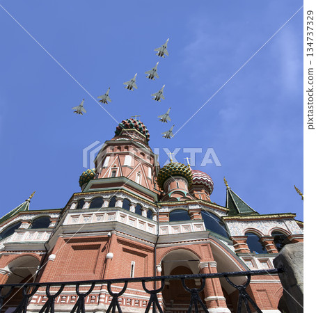 Temple of Basil the Blessed and Russian military aircraft in the sky,  Air parade in honor of Victory Day celebration (WWII), Red Square, Moscow, Russia 134737329