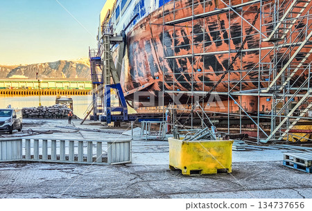 Ship Hull Repair With Scaffolding in Industrial Shipyard 134737656
