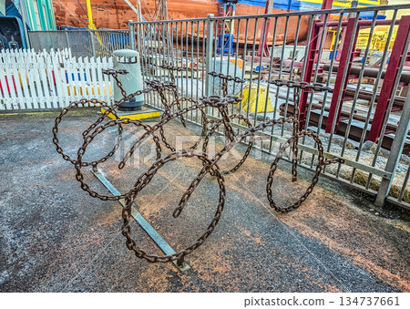 Bicycle Shaped from Rusty Metal Chains at Industrial Site Bicycle Shaped from Rusty Metal Chains at Industrial Site 134737661