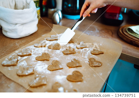 making heart-shaped gingerbread cookies 134739751
