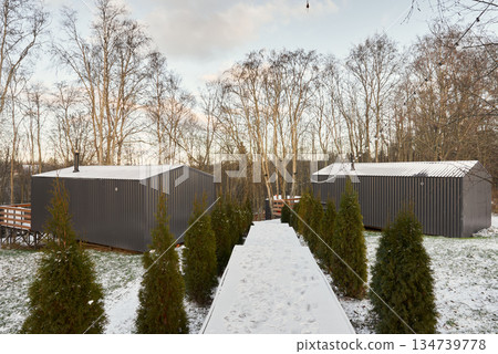 Modern small homes with sleek facades and scenic environment 134739778