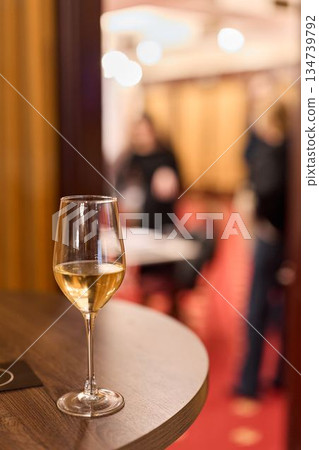 Refined Atmosphere With Warm Illumination, Sophisticated Ambiance Captured With Blurred Guests In Focus Refined Atmosphere With Warm Illumination, Sophisticated Ambiance Captured With Blurred Guests In Focus 134739792