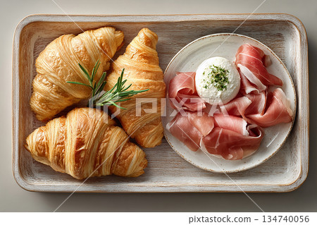 Homemade breakfast. Top view. Tray with cornetti, prosciutto and fresh ricotta in plate on a white background. Italian spread. European hotel breakfast. Homemade breakfast. Top view. Tray with cornetti, prosciutto and fresh ricotta in plate on a white background. Italian spread. European hotel breakfast. 134740056