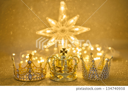 Three golden crowns representing epiphany and three wise on glitter background Three golden crowns representing epiphany and three wise on glitter background 134740938