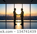 Handshake with the sunset in the background 134741439