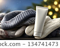 Cream placed on a stack of cozy winter hats and gloves in a chilly setting 134741473