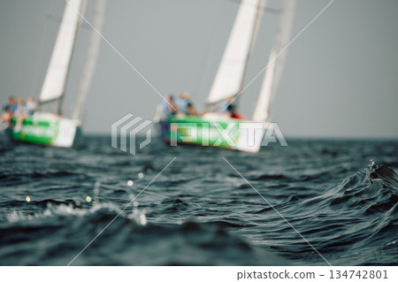 Sailing regatta in the Gulf of Finland, sailing yacht competing in a race, splashing water from under the boat, teamwork, board the boat 134742801