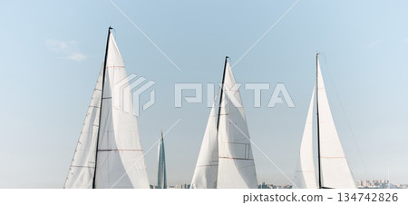 multiple sails at the sailing regatta in the Gulf of Finland, hot race of several yachts, nobody multiple sails at the sailing regatta in the Gulf of Finland, hot race of several yachts, nobody 134742826