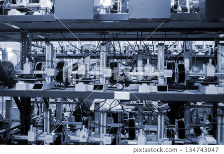 Many 3D printers printing object. 3D printers printing model from molten plastic. 3D printers creating shape from molten plastic flowing out of extruder. New modern 3D Printing additive technologies 134743047