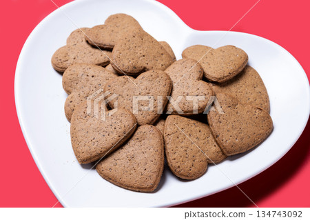 Heart-shaped ginger cookies Heart-shaped ginger cookies 134743092