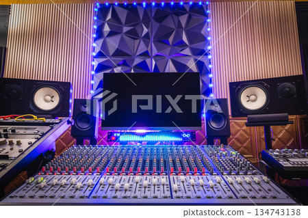 home recording studio. mixing console, studio monitors, desktop computer and professional audio equipment with modern sound diffuser wall design. home recording studio. mixing console, studio monitors, desktop computer and professional audio equipment with modern sound diffuser wall design. 134743138