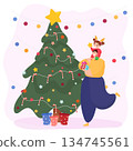 Father and daughter decorate the Christmas tree 134745561