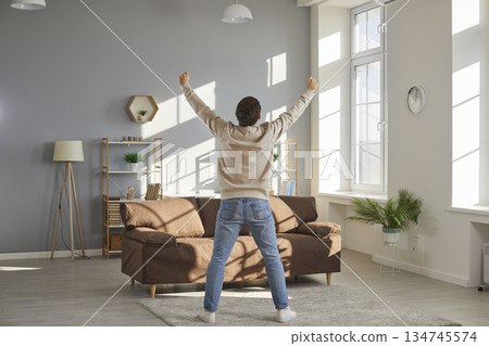 Happy funny husband and father is alone at home, enjoying freedom and having fun Happy funny husband and father is alone at home, enjoying freedom and having fun 134745574