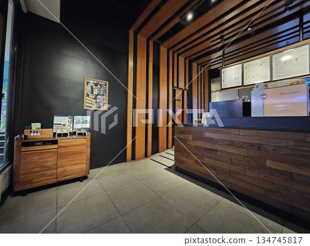 inside of a room with a wooden door and a mirror inside of a room with a wooden door and a mirror 134745817