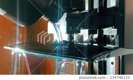 Pouring liquid resin into 3d printer vat before starting SLA printing process Pouring liquid resin into 3d printer vat before starting SLA printing process 134746133