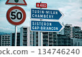 Road direction signs to Turin, Milan, Chambery, Sisteron, Gap, Briancon on A480 in France 134746240