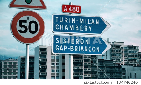 Road direction signs to Turin, Milan, Chambery, Sisteron, Gap, Briancon on A480 in France 134746240