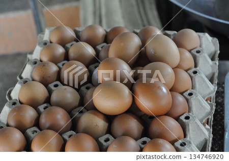 Brown egg chicken egg organic food fresh ingredient farm produce protein carton tray market scene Brown egg chicken egg organic food fresh ingredient farm produce protein carton tray market scene 134746920