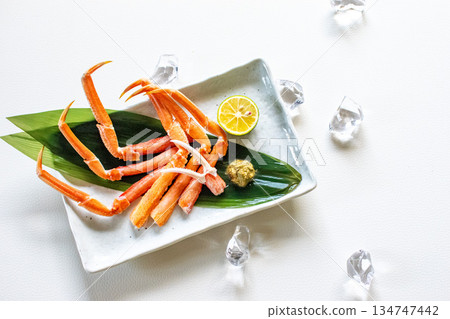 Peeled crab legs portion 134747442