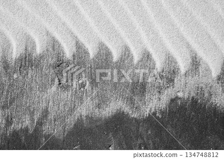 Intricate patterns form in the sand Intricate patterns form in the sand 134748812