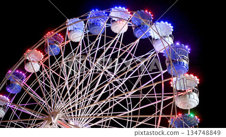Spinning ferris wheel in motion Spinning ferris wheel in motion 134748849