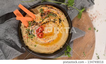 Delicious hummus in ceramic bowl Delicious hummus in ceramic bowl 134749018