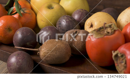 Autumn fruits on rustic table 134749021