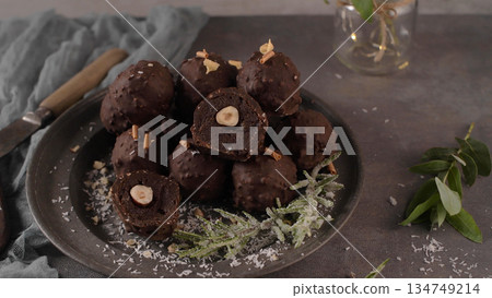 Dark chocolate truffles with hazelnuts Dark chocolate truffles with hazelnuts 134749214