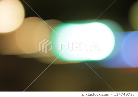 Abstract Bokeh Background with Slow Shutter Speed Effect Featuring Blurred Light Circles in Motion for Creative Design and Atmospheric Visuals 134749753