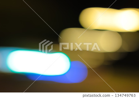 Blurred Light Streaks with Slow Shutter Speed, Motion Effect for Visual Backgrounds and Abstract Designs in Urban Night Photography Blurred Light Streaks with Slow Shutter Speed, Motion Effect for Visual Backgrounds and Abstract Designs in Urban Night Photography 134749763