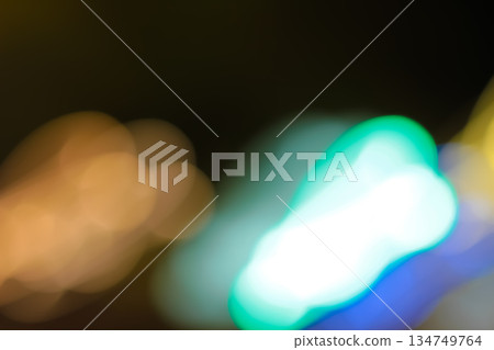Abstract blurred light trails of colorful bokeh with slow shutter speed for vibrant urban night scene or motion effect background, artistic expression Abstract blurred light trails of colorful bokeh with slow shutter speed for vibrant urban night scene or motion effect background, artistic expression 134749764