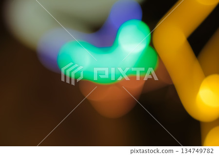 Abstract colorful light trails creating a blurred bokeh effect with a slow shutter speed for artistic background applications Abstract colorful light trails creating a blurred bokeh effect with a slow shutter speed for artistic background applications 134749782