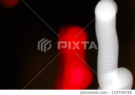 Blurred Light Trails with Slow Shutter Speed Photography Effect, Red and White Lights on Dark Background, Motion Blur for Abstract Visual Effect Blurred Light Trails with Slow Shutter Speed Photography Effect, Red and White Lights on Dark Background, Motion Blur for Abstract Visual Effect 134749786