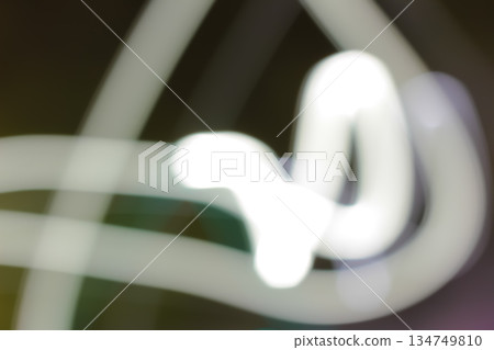 Abstract Light Trails with Slow Shutter Speed Technique, White Lines Against Dark Background, Motion Blur and Defocused Effect, Speed of Light Concept 134749810