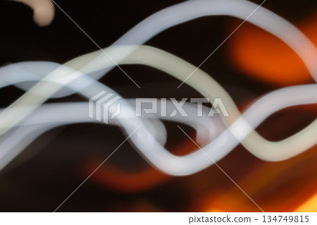 Blurred Light Trails Flowing with Slow Shutter Speed, Creating Abstract Visuals with Dynamic Energy and Creative Motion for Artistic Expression Blurred Light Trails Flowing with Slow Shutter Speed, Creating Abstract Visuals with Dynamic Energy and Creative Motion for Artistic Expression 134749815