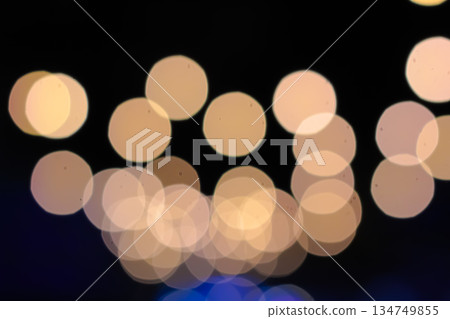 Abstract Bokeh Lights Sparkling on Dark Background, Creating a Dreamy and Festive Ambiance for Holiday Season Abstract Bokeh Lights Sparkling on Dark Background, Creating a Dreamy and Festive Ambiance for Holiday Season 134749855