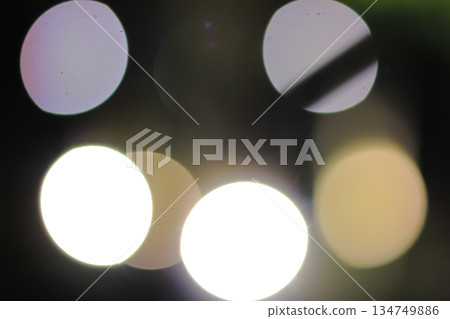 Abstract Bokeh Lights Forming Soft Glowing Circles on Dark Background for Festive or Dreamy Ambiance Abstract Bokeh Lights Forming Soft Glowing Circles on Dark Background for Festive or Dreamy Ambiance 134749886