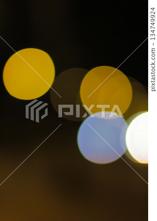 Abstract Bokeh Lights Background with Glowing Circular Shapes and Dark Backdrop, Ideal for Festive Season and Creative Design Projects Abstract Bokeh Lights Background with Glowing Circular Shapes and Dark Backdrop, Ideal for Festive Season and Creative Design Projects 134749924