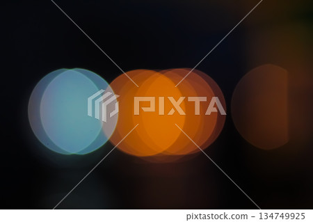 Abstract Blue and Orange Bokeh Circles Floating in Dark Space for a Dreamy or Artistic Background Effect, soft focus Abstract Blue and Orange Bokeh Circles Floating in Dark Space for a Dreamy or Artistic Background Effect, soft focus 134749925