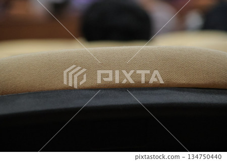 Close-up of Tan Upholstery on Furniture with a Curved Black Frame Detailing for Texture and Design Element Use Close-up of Tan Upholstery on Furniture with a Curved Black Frame Detailing for Texture and Design Element Use 134750440