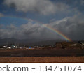A long rainbow over the Kancho Plain (winter sky, Shikoku Mountains and rainbow) 134751074