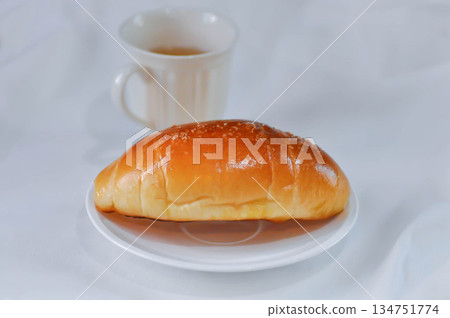 Shio Pan, Salzstangerl bread or Austria bread or Japanese bread and hot tea Shio Pan, Salzstangerl bread or Austria bread or Japanese bread and hot tea 134751774