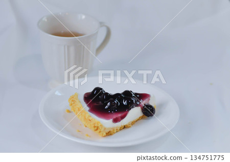 blueberry cheese cake, blueberry cheese tart and hot tea blueberry cheese cake, blueberry cheese tart and hot tea 134751775