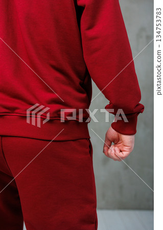 Captivating Stylish Red Sportswear A CloseUp of a Man Wearing an Athletic Tracksuit, Radiating Energy and Focused Pose, Perfectly Illustrating the Spirit of Modern Athletic Fashion Captivating Stylish Red Sportswear A CloseUp of a Man Wearing an Athletic Tracksuit, Radiating Energy and Focused Pose, Perfectly Illustrating the Spirit of Modern Athletic Fashion 134753783