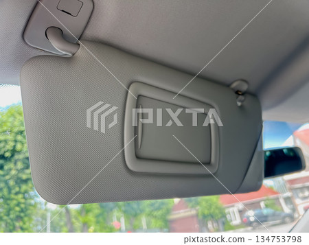 Interior View of a Car Sun Visor with Mirror Slot Interior View of a Car Sun Visor with Mirror Slot 134753798