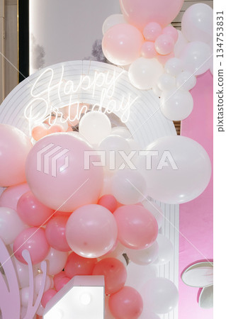 An Elegant Birthday Celebration Backdrop featuring a beautiful array of Pink and White Balloons complemented by a striking Neon Sign to enhance the festive atmosphere of the event An Elegant Birthday Celebration Backdrop featuring a beautiful array of Pink and White Balloons complemented by a striking Neon Sign to enhance the festive atmosphere of the event 134753831