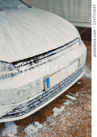 Car Wash Foam A Vehicle Completely Covered in Luxurious Cleaning Foam During a Full Detailing Session Designed to Significantly Enhance Its Shine as Well as Its Overall Cleanliness and Appeal 134753847