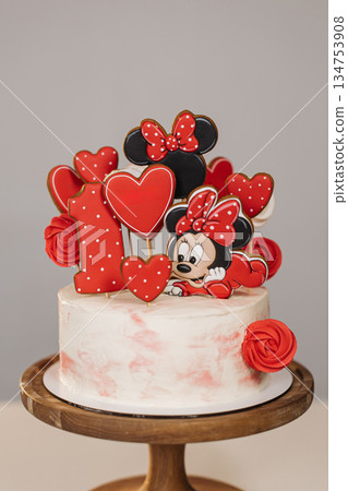 This delightful Mickey Mouse birthday cake features vibrant and colorful decorations that are just perfect for celebrating a first birthday, making it an exceptionally festive addition to any party 134753908