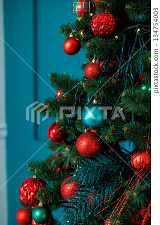 Celebrate the festive spirit this holiday season with vibrant Christmas tree decorations featuring beautiful ornaments in lively red and blue colors, bringing joy and cheer to your home interior Celebrate the festive spirit this holiday season with vibrant Christmas tree decorations featuring beautiful ornaments in lively red and blue colors, bringing joy and cheer to your home interior 134754003